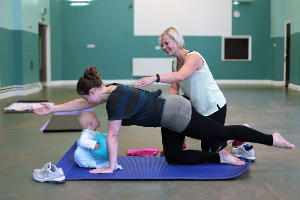 Exercising on all fours at pilates class.